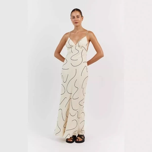 Women's deep V-neck maxi dress with abstract print and open back for summer elegance