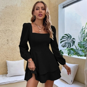 Detail of square neckline and puff sleeves on black ruffled summer tiered dress