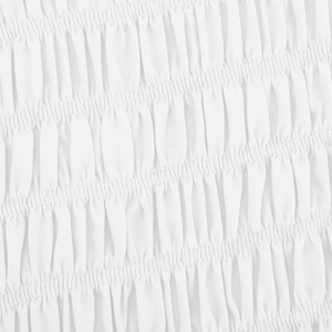 Detailed close-up showing smocking and elastic shirring on white cotton fabric