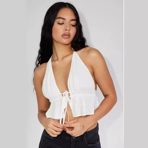 White halter neck crop top with deep V-neck, front ties and ruffled hem for summer