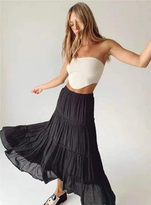 Dynamic view of black layered tiered maxi skirt showing elegant ruffle movement and texture