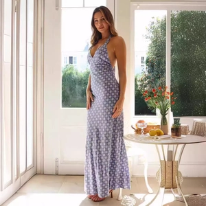 Close-up of high-waist purple floral maxi dress with halter V-neck and open back