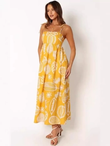 Yellow tropical print maxi dress with spaghetti straps and high waist for summer fashion
