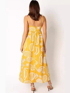 Lemon yellow floral maxi dress with fruit print, backless design and thin straps