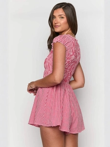 Red and white checkered romper with ruffled hem and elastic smocked bodice for summer
