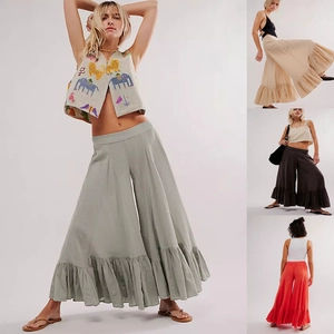 Detail of bohemian wide-leg palazzo pants with ruffled hem in four assorted colors