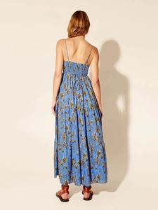 Floral print maxi dress with smocked back and tiered skirt shown from a back view