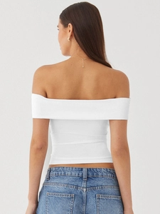 Back view of a white off-shoulder slim-fit T-shirt in elastic knit with light blue jeans