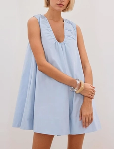 Detail of V-neck pleats on a light blue sleeveless loose A-line summer midi dress