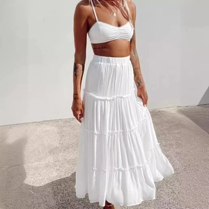 Sexy white two-piece set with a cropped camisole top and a layered tiered maxi skirt