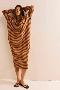 Detail of long sleeve oversized knitted dress with brown and yellow horizontal stripes