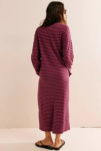 Detail view of burgundy and pink striped long-sleeve maxi dress with back slit