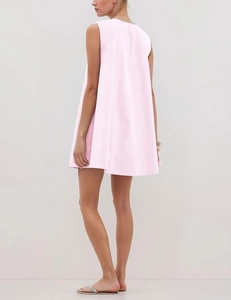 Rear view of a pink sleeveless A-line dress with elegant pleats and loose fit design