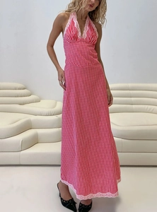 Detail of red gingham halter maxi dress with delicate pink lace trim on edges