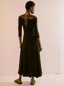 Elegant off-shoulder black maxi dress with back tie and flared silhouette for women