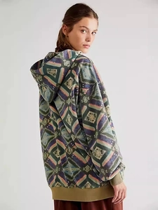 Women's oversized hoodie featuring retro geometric print in earthy autumn tones