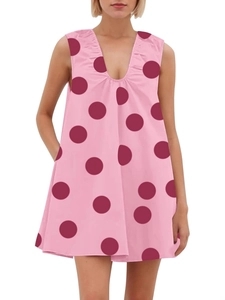 Pink V-neck A-line sleeveless dress with large burgundy polka dots and side pockets