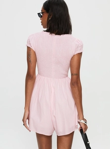Detail of smocked texture and vertical stripes on pink slim fit romper back view
