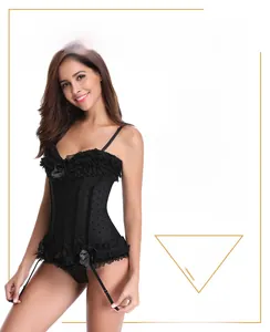 Detail of black polka dot corset featuring lace ruffles and decorative satin bows