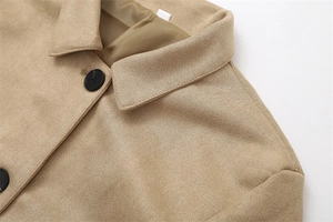 Detail of khaki faux suede short jacket featuring lapel collar and large black button
