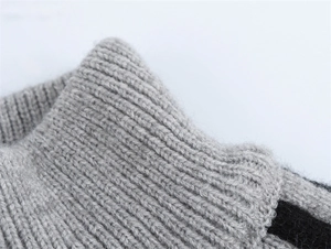 Gros plan sur la texture en tricot côtelé gris montrant les détails de la laine