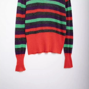 Relaxed fit striped crewneck knit sweater with fuzzy texture in purple and green tones