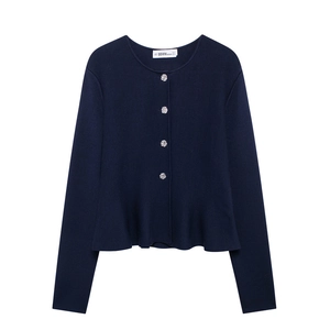 Women's navy blue knitted cardigan with floral buttons and elegant peplum hem detail