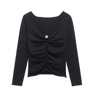 Slim fit black V-neck knit top featuring silver bead detail and ruched front design