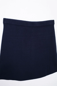 Detailed flat lay of a navy blue A-line knit mini skirt with elasticated waist
