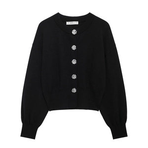 Women's black knit cardigan with silver spiral metal buttons and ribbed cuffs