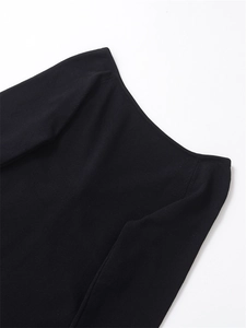 Detailed view of black knitted off-shoulder top with V-neckline and fine fabric texture