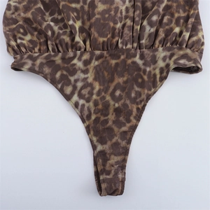 Macro view of leopard print bodysuit with high cut thong and elastic pleated edges
