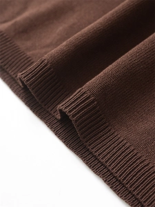 Close-up of the ribbed cuff and fine knit texture on a dark brown sweater