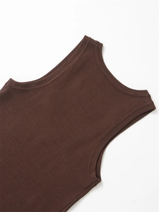 Close-up of dark brown ribbed knit vest fabric showing neckline and armhole tailoring
