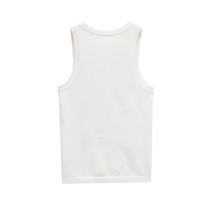 Close-up of white knitted sleeveless top showing neckline and soft texture