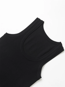 Close-up of black ribbed knit tank top showing wide U-neckline and fine fabric texture