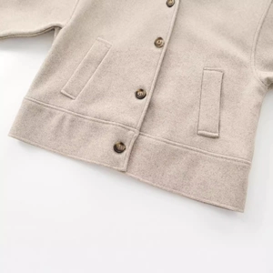 Oatmeal wool-textured lapel jacket with stylish resin buttons and oversized pockets