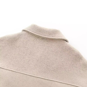 Oatmeal wool coat with classic lapel collar and premium stitching detail in loose fit