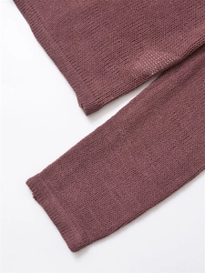 Close-up of sleeve cuffs and stitching on dusty purple long sleeve knit sweater
