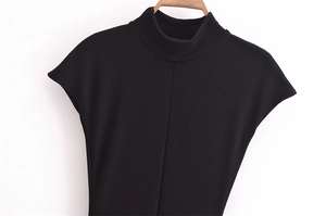 Detail of a slim fit black high neck sleeveless top with a vertical center stitch line