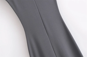 Close-up detail of smooth dark gray woven fabric showing professional vertical stitching