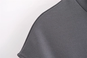 Detailed close-up showing the fine knit texture and stitching of this slim dark grey dress