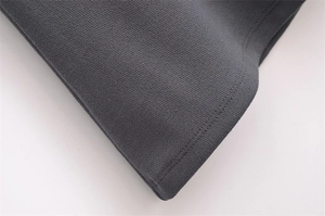 Detail of the high-quality double-needle stitching on grey knit dress hemline