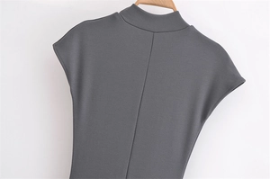 Detail view of the slim-fit dark grey knit dress with mock neck and back seam detail