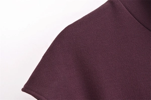 Detailed macro view of the premium dark purple knitted fabric texture and seamless stitching