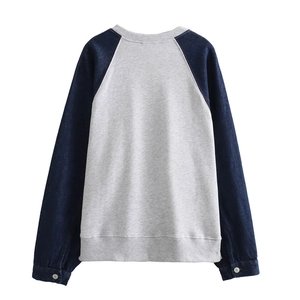 Women's autumn grey sweater with contrast dark blue denim patchwork raglan sleeves