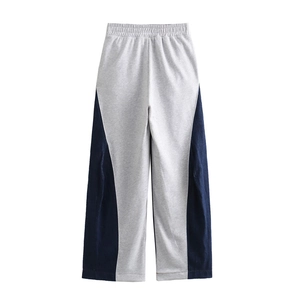 Grey wide-leg sweatpants with blue denim patchwork and elastic waistband