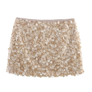 Sparkling champagne beige sequin mini skirt with high waist and layered disc detailing