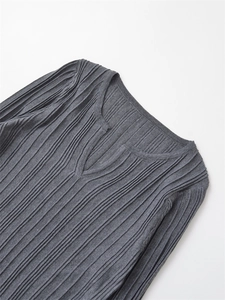Macro shot of dark grey ribbed knit long sleeve shirt with a unique split V-neck detail
