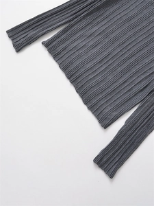 Detail of dark grey pleated fabric texture with elegant vertical accordion folds